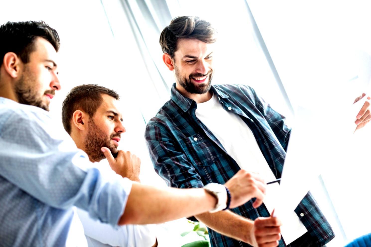 Small business owner reviewing financial reports and planning business growth strategies