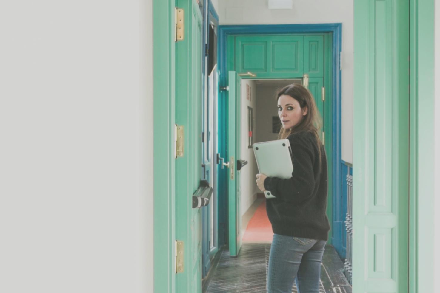 Business owner reviewing financial reports with confidence